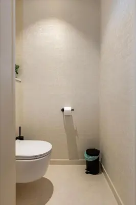 a bathroom with a toilet and a roll of toilet paper at Borgerhouse B&B in Antwerp