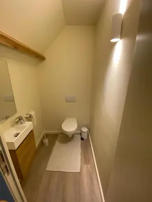 a bathroom with a toilet and a sink at B&B Vrijheid 4 in Arendonk