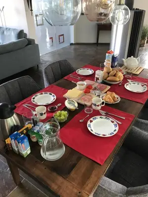 a table with plates and food on top of it at Hazegewoud in Arendonk