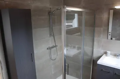 a bathroom with a shower and a sink at AmberHuis in Kasterlee