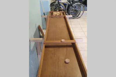 a ping pong table with two ping pong balls on it at AmberHuis in Kasterlee