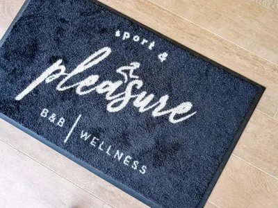 a black rug with the word france on it at B&B Welness Sport and Pleasure in Laarne