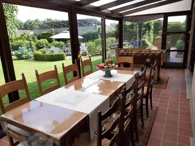 a dining room with a table and chairs at Den Donkman in Dessel