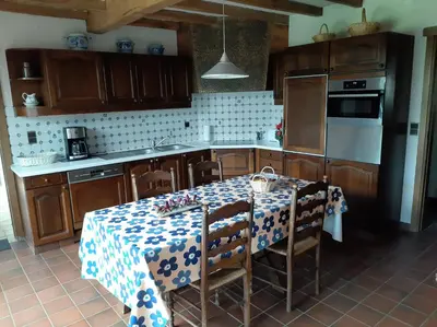 a kitchen with a table with a table cloth on it at Den Donkman in Dessel