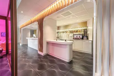 a kitchen with a bar in a room at Prize by Radisson, Antwerp City in Antwerp