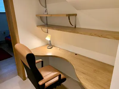 a desk and a chair in a room at Appartement Chez Agnes in Brussels