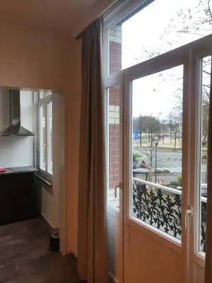 a room with a window with a view of a street at Brussel House Basilic in Brussels