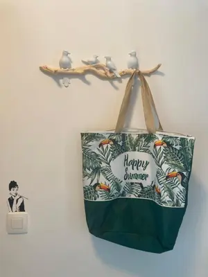 a bag with a happy summer sign on a wall at Dreamland Apartments EU, Brussels in Brussels