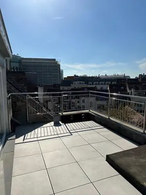 a balcony with a view of a city at Dreamland Apartments EU, Brussels in Brussels