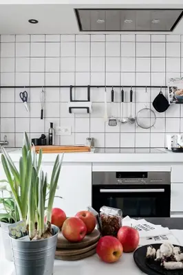 a kitchen with a plate of fruit on a counter at MAISON12 - Design apartments with terrace and view over Ghent towers in Ghent