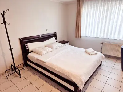a bedroom with a large bed in a room at Flatpolis Brussels Airport Budget in Diegem