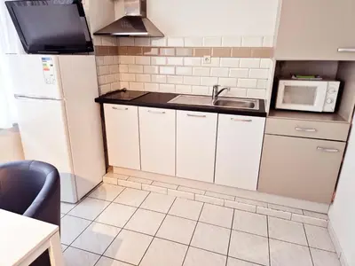 a small kitchen with a sink and a microwave at Flatpolis Brussels Airport Budget in Diegem
