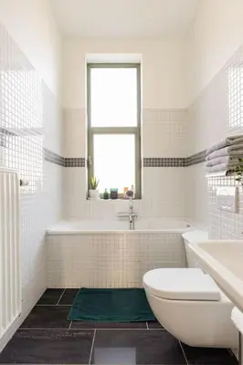 a bathroom with a toilet and a tub and a sink at Bel appart proche de gare du Midi, à côté du Centre Ville in Brussels