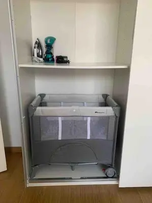 an empty refrigerator with its door open in a room at Bel appart proche de gare du Midi, à côté du Centre Ville in Brussels