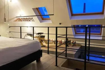 a bedroom with a helicopter on display in a room at L'atique by Agelandkaai be with Free Parking in Ghent