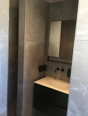 a bathroom with a sink and a mirror at L'atique by Agelandkaai be with Free Parking in Ghent