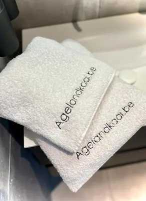 a white towel with the word accident registration on it at L'atique by Agelandkaai be with Free Parking in Ghent