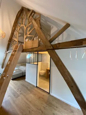 a room with a loft bed with glass walls at Quadratum 1769 in Herzele