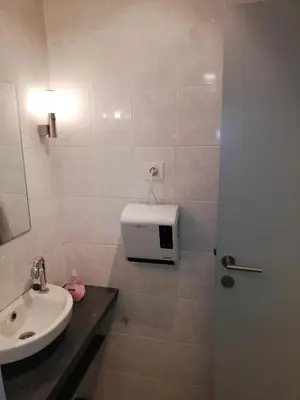 a bathroom with a sink and a toilet and a shower at NUVOLA Summer Spring in Zottegem