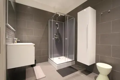 a bathroom with a shower and a toilet at NUVOLA VIEW in Zottegem