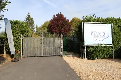 a gate with a sign in front of a building at NUVOLA VIEW in Zottegem