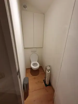 a small bathroom with a toilet in a stall at Brussels North - Pajot Apartments in Wemmel