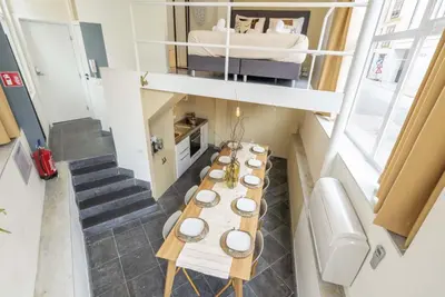 a small room with a table and a bed at SHWAY60 Family House in Antwerp