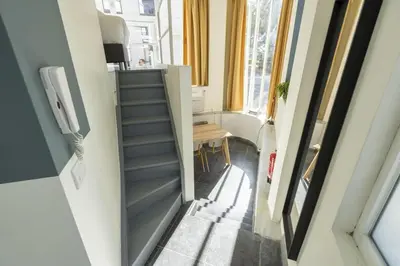 an internal hallway of a tiny house with a staircase at SHWAY60 Family House in Antwerp