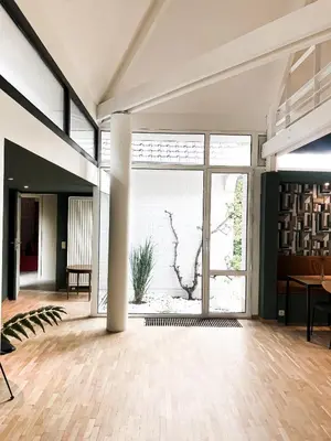 a large room with a large window and a table at The Oak in Wavre