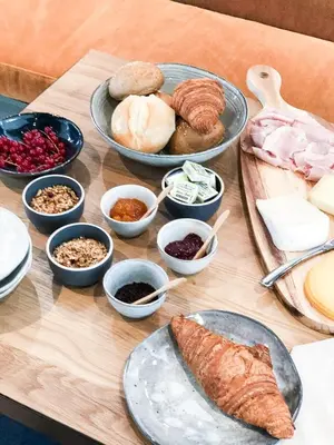 a table topped with plates of food and bowls of food at The Oak in Wavre
