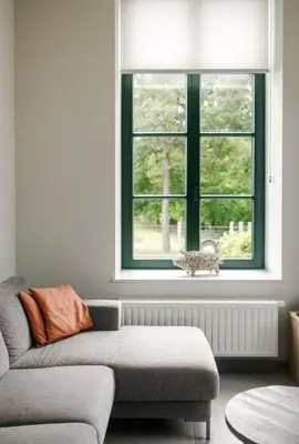 a living room with a couch and a window at Lianko - Vakantiewoning in Bekkevoort