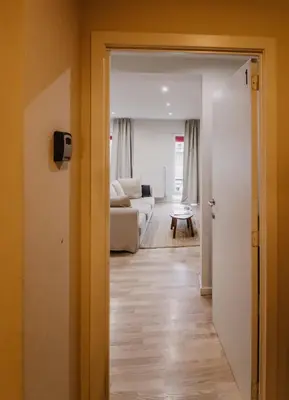 a view of a living room with a white couch at Central and Cozy in Brussels in Brussels