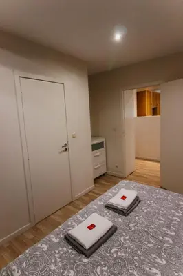 a bedroom with two white towels on a bed at Central and Cozy in Brussels in Brussels