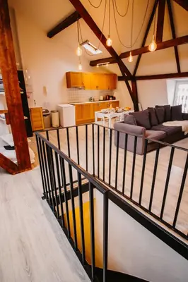 a view of a living room and kitchen from the balcony of a house at Super central in Brussels in Brussels