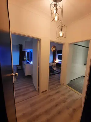 a hallway with a door leading to a living room at Antwerp Hideaway, outside of low emission zone in Antwerp