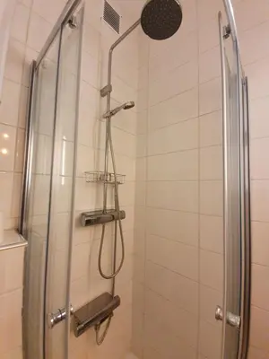 a shower in a bathroom with a glass door at Antwerp Hideaway, outside of low emission zone in Antwerp