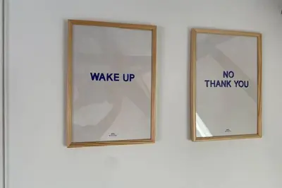 two mirrors with words on them on a wall at GLORIA LOFT GENT in Ghent
