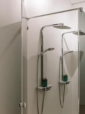 a shower in a bathroom with a mirror at BnB Manere in Grimbergen