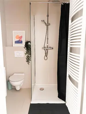 a shower stall in a bathroom with a toilet at Appartement op top locatie in Antwerpen in Antwerp