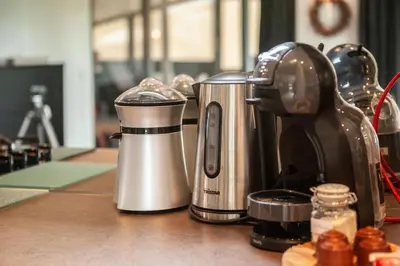 a coffee maker sitting on top of a counter at Prachtige chalet Wabi Sabi aan het water! in Geel