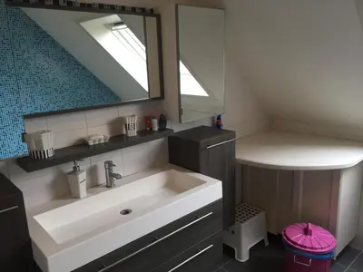 a bathroom with a sink and a mirror at Julie's Place in Westerlo