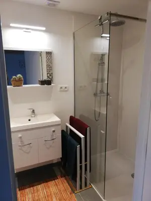 a bathroom with a sink and a shower at Noest in Destelbergen
