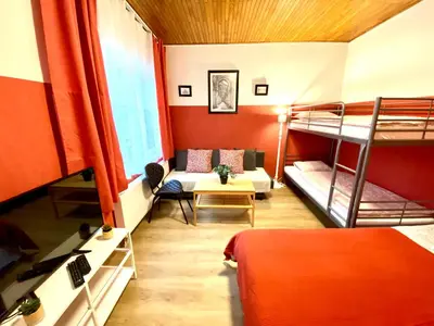 a room with two bunk beds and a couch at Сarnot Apartments ZOO Area in Antwerp
