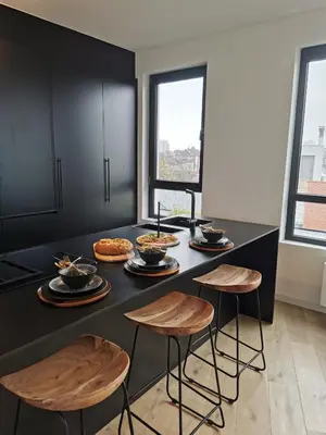 a kitchen with a table with food on it at The Penthouse, oasis of light and inspiration in Antwerp