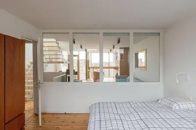 a bedroom with a bed and a large mirror at Top Floor New Duplex Stunning View In Trendy St Gilles in Brussels