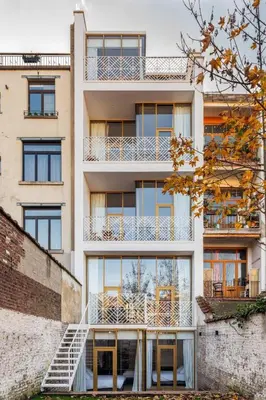 an apartment building with a staircase in front of it at Top Floor New Duplex Stunning View In Trendy St Gilles in Brussels