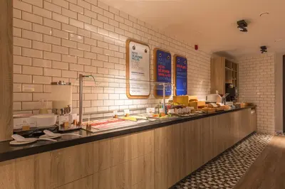 a buffet line with many different types of food at Holiday Inn Express Brussels-Grand-Place by IHG in Brussels