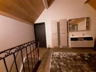 a room with a staircase and a mirror at Vélo 94 in Geel