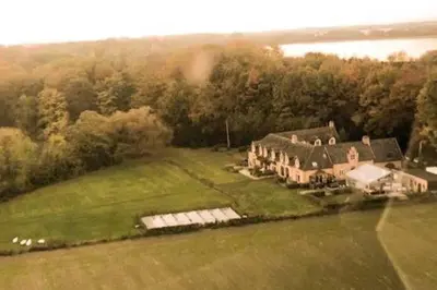 an aerial view of a large house on a field at Gastenhuis prachtige Historische Vierkant Hoeve in Broechem