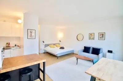 a living room with a bed and a couch at New Studio ! in Brussels